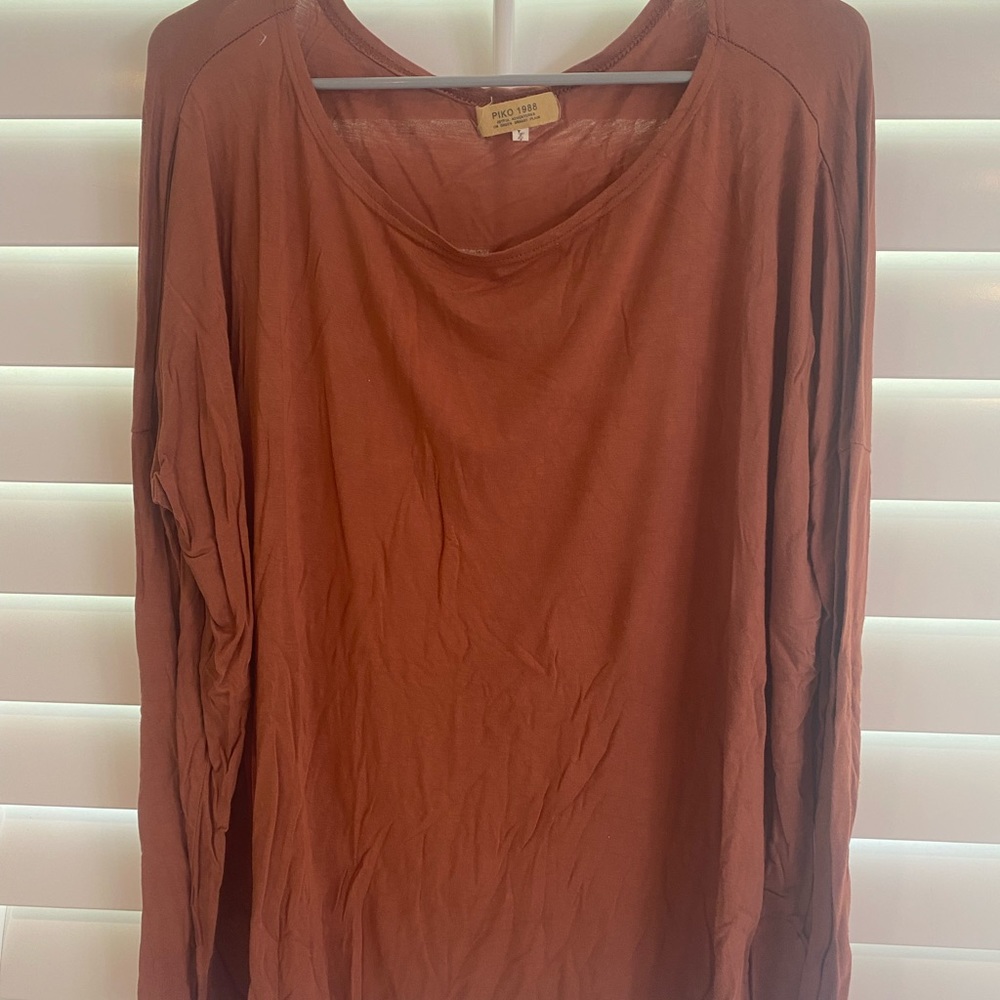Burnt orange Piko shirt. Size L.